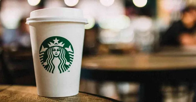 Cup of Starbucks coffee on a wooden table