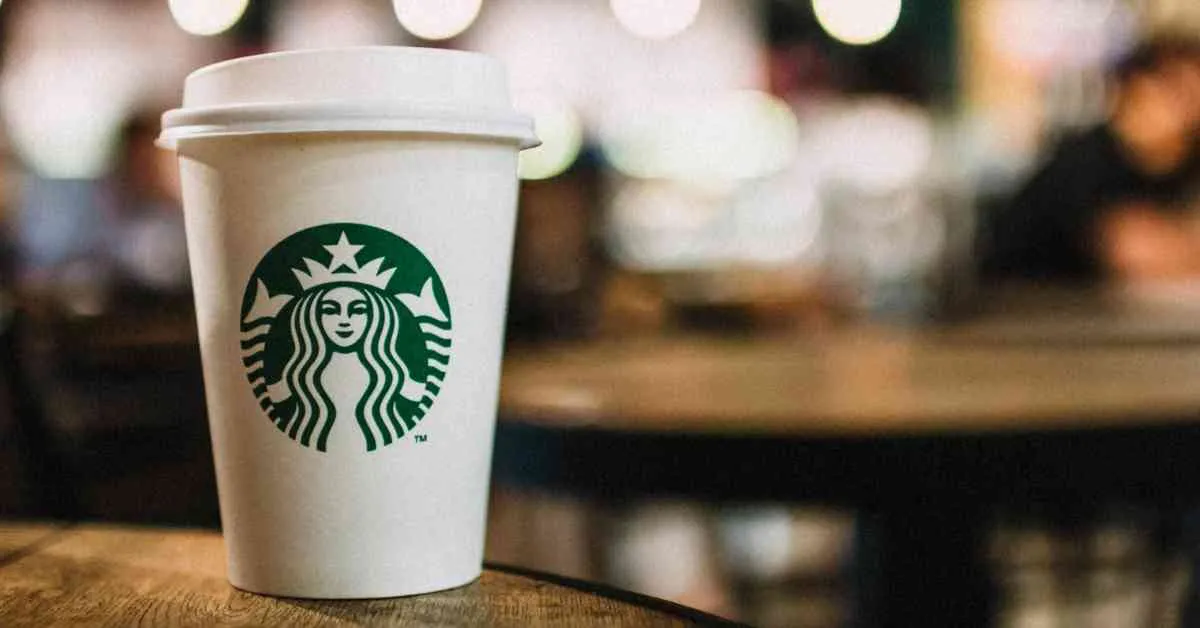 Cup of Starbucks coffee on a wooden table