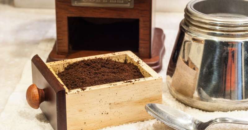 Freshly ground coffee and a Moka pot