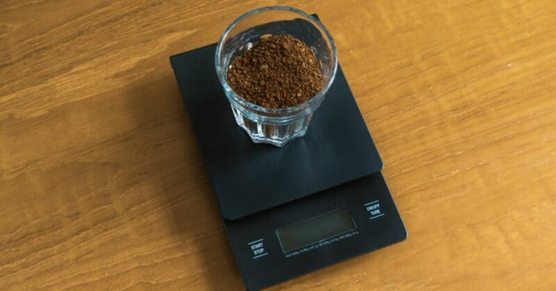 Weighing coffee grounds on a kitchen scale